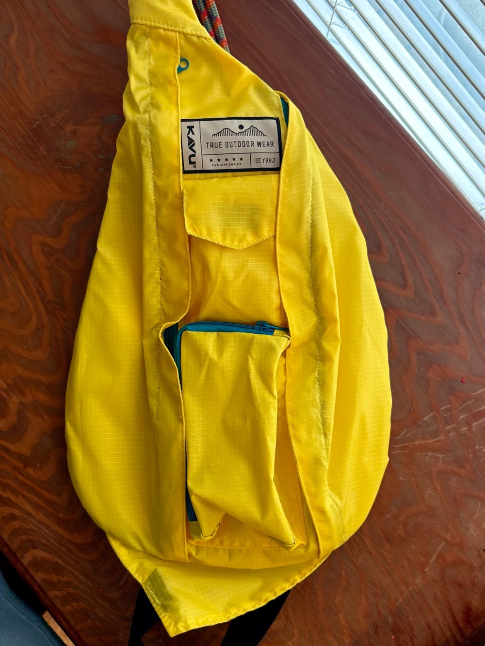 Kavu Yellow Sling Bag with Teal Zippers